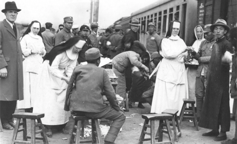 Misson nuns helping wounded